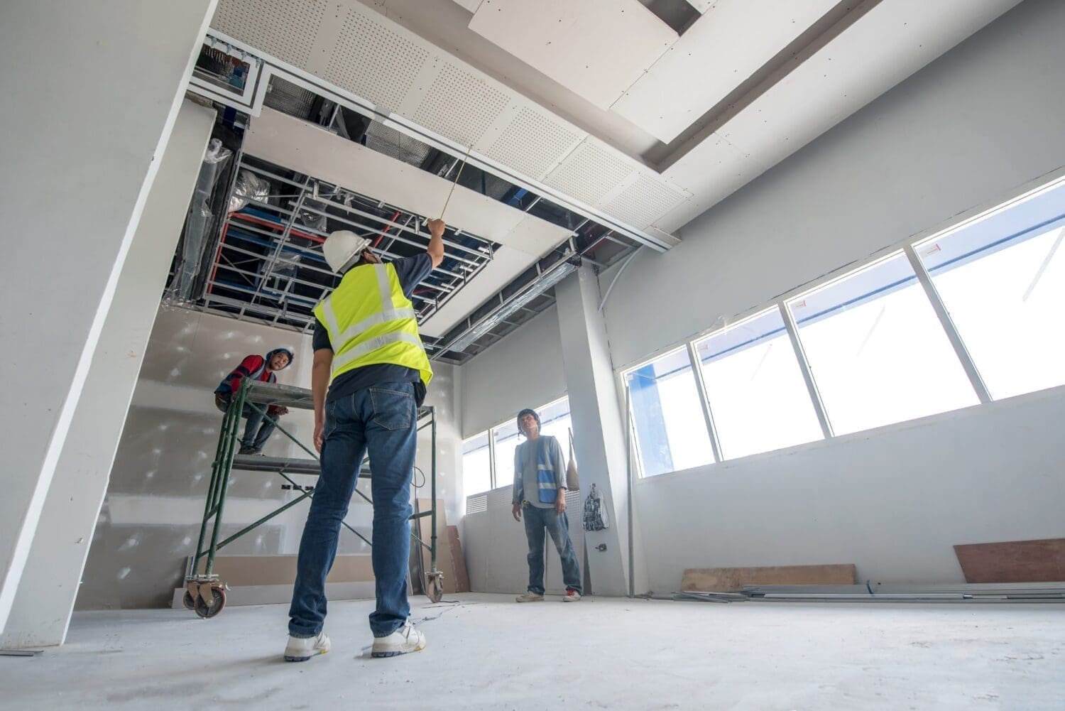 Construction worker ceiling work