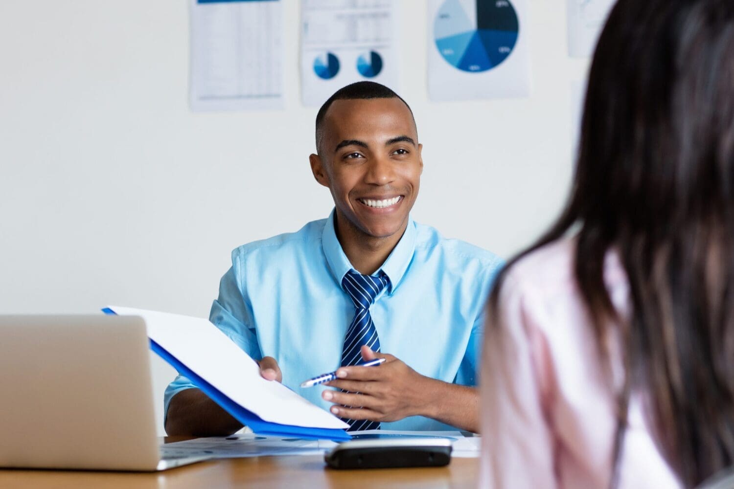 African american businessman presenting contact for new job at office of business company